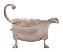 A George II silver sauceboat, maker Fuller White, London, 1748: of traditional design,