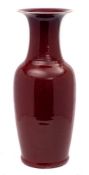 A large Chinese flambe baluster vase: covered overall in a mottled ox-blood and lavender glaze,