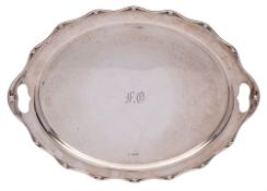 A George V silver serving tray, maker John Round, Sheffield, 1935: initialled, of oval outline,