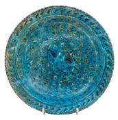 An Islamic pottery bowl of Sultanabad type: painted in black and blue with a pair of cranes on a