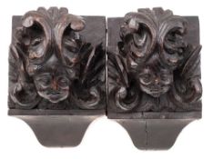 A pair of late 17th/early 18th century carved oak corbels: carved as angel's faces,