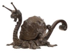 A 19th century bronze inkwell in the form of a mythical sea snail: the lion's head with antennae on