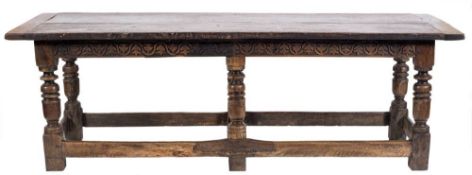 A 17th Century and later oak refectory table:, with an overhanging plank top,