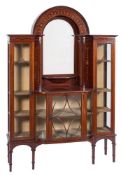An Edwardian mahogany and marquetry domed display cabinet on a stand:, of bowed breakfront outline,