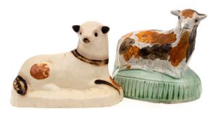 A Bovey Tracey creamware figure of a recumbent lamb and a similar Prattware figure: the first