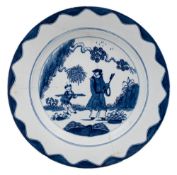 A Bow blue and white 'Golfer and Caddy' pattern plate and a pair of 'lotus and bamboo' octagonal