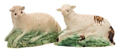 Two Staffordshire models of reclining sheep: decorated in green and brown glazes, circa 1800,