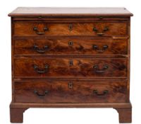 A George III mahogany rectangular chest:, the top with a moulded edge,