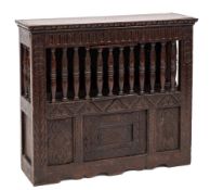 A 19th Century carved oak food cupboard:, in the 17th Century taste,