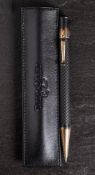 A silver mounted 'Yard-O-Led ball point pen: with black chequered body.