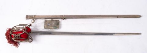 An Officer's Highland Pattern broadsword by Wilkinson: the straight double edge blade with traces