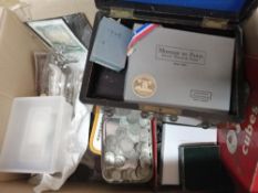 Box of coins, banknotes, medals, loose and in tins.