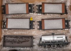A group of four loose O gauge coal wagons: together with a 4 ton open wagon and a Unigate