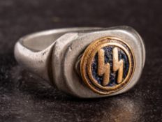 A German SS signet ring: in silver coloured metal with circular black and gilt enamel motif.