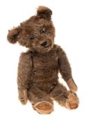 An early 20th century brown plush Teddy bear: with boot button eyes,
