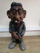 A late 20th century carved wood statue of Serge Gainsbourg: