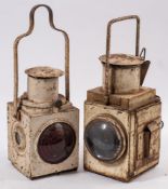 A BR(E) signal lamp with red lens and one other BR(E) lamp with double bullseye lenses: both white