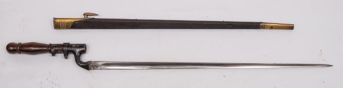 An 1876 pattern Martini Henry bayonet fitted later wooden handle: (used for home defence) in gilt