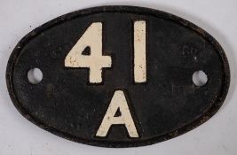 An Eastern region cast iron oval shed plate '41A': 19cm wide.
