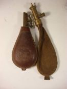 Two brass and leather shot/powder flasks with charger gates: (2)