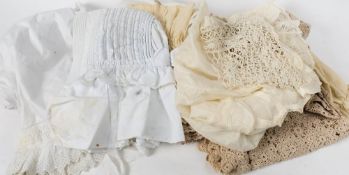 A quantity of various textiles including a white cotton bonnet and a christening gown: (a lot).