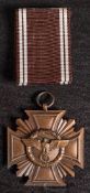 A Third Reich NSDAP Ten Years Long Service Award in bronze: with ribbon in box of issue.