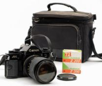 A Canon A-1 35mm SLR camera: fitted Unitor 35-70mm lens, together with a Sunpak Auto 28SR flash,