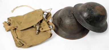 Two WWII Brodie pattern ARP helmets: together with a canvas gas mask bag and an ARP whistle by J