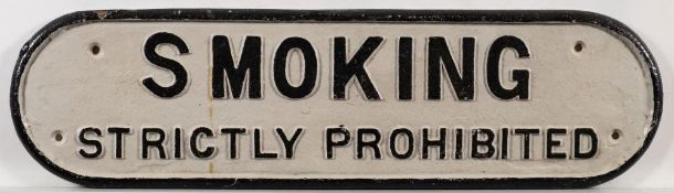 A cast iron doorplate 'Smoking Strictly Prohibited': 15 x 54.5cm.