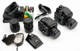 Two Mamiya 645 1000s large format cameras: both fitted,a Mamiya-Sekor 80mm lens,