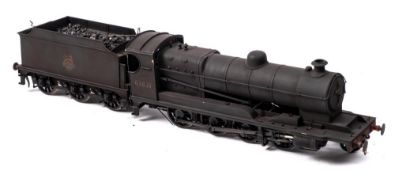A kit built O gauge model of a BR Class 04/3 2-8-0 locomotive and tender No 63821: black with