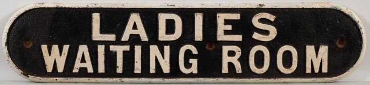 A cast iron doorplate 'Ladies waiting Room': double line 12 x 53cm.