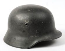 A WWII German M3 pattern helmet: with leather liner stamped '55'.