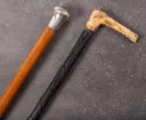 A 19th century Irish antler handled carved bog oak walking stick: the shaft with relief carved