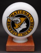 A reproduction Benzole National Mixture petrol pump globe: black and yellow on white glass,