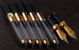 Two Onoto gold plated medium steel nibs and five converters.