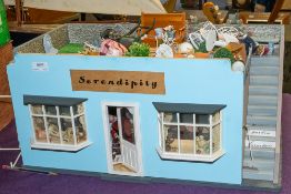 A 20th Century doll's shop 'Serendipity' with fitted interior, figures, fixtures and fittings.