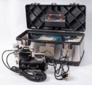 An Iwata Studio Series Sprint Jet compressor with airbrush and accessories in rigid case:.