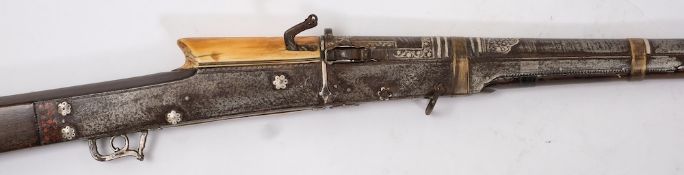 An early 19th century Indian Matchlock musket (Turador): the 39 inch barrel decorated to muzzle and