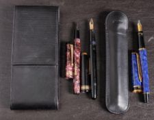 A Waterman fountain pen in blue marbled finish: together with a red marbled Conway Stewart No 388