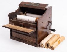 A late 19th century American Mercantile Co 'Melodia' Organette: with 8 inch spools in a gilt