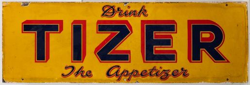An enamel sign 'Drink Tizer. The Appetizer': blue and red text on a yellow ground, 30.5 x 90.5cm.