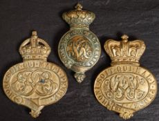 Two Victorian brass Royal cavalry horse harness crowns and a later Edwardian example:(3)
