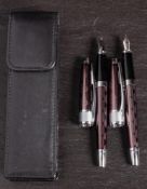 A Cross pen set: comprising fountain pen and biro with dark metallic coloured body with geometric