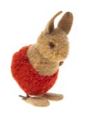A mid 20th century Steiff puff ball rabbit, circa 1950s/60s: with felt ears and glass eye,