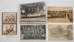 A collection of early 20th century postcards: various subjects including 'Empire Day Dawlish',