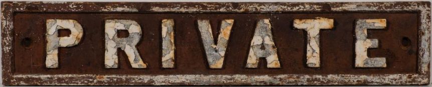 A cast iron doorplate 'Private': 9 x 45.5cm.