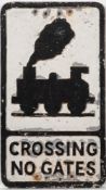 A cast aluminum road sign 'Crossing No Gates': with an image of a 0-6-0 locomotive with smoke over