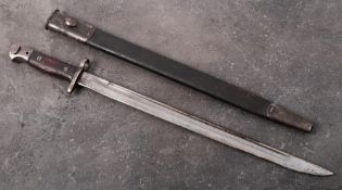 A 1907 pattern bayonet by Wilkinson: the straight single edge fullered blade stamped with crown and