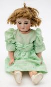 A late 19th/early 20th century bisque head doll by J Steiner-J Bourgoin: applied blonde wig over